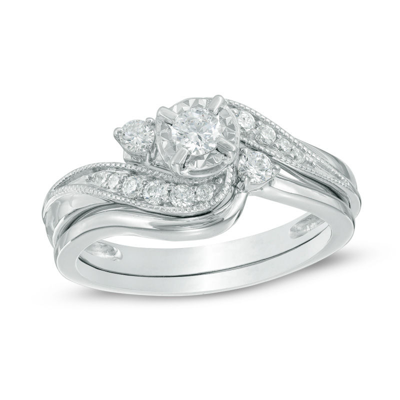 3/8 CT. T.W. Slant Three Stone Bridal Set in 10K White Gold