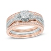 Thumbnail Image 0 of 7/8 CT. T.W. Diamond Twisting Three Piece Bridal Set in 14K Two-Tone Gold
