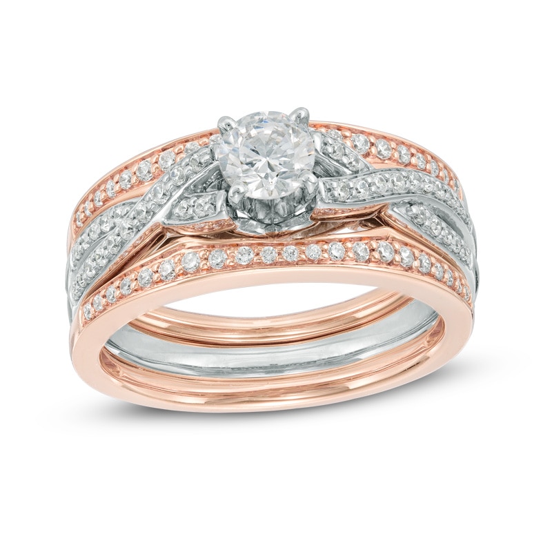 7/8 CT. T.W. Diamond Twisting Three Piece Bridal Set in 14K Two-Tone Gold
