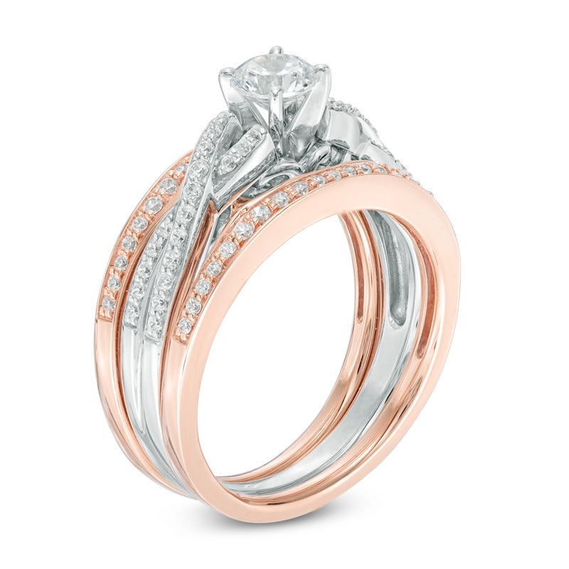 7/8 CT. T.W. Diamond Twisting Three Piece Bridal Set in 14K Two-Tone Gold