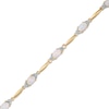 Thumbnail Image 0 of Lab-Created Oval Opal and Diamond Accent Bracelet in Sterling Silver and 10K Gold Plate - 7.25"