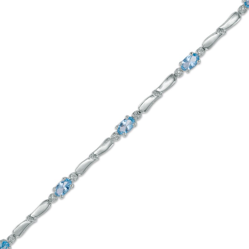 Main Image 1 of Oval Swiss Blue Topaz and Diamond Accent Bracelet in Sterling Silver