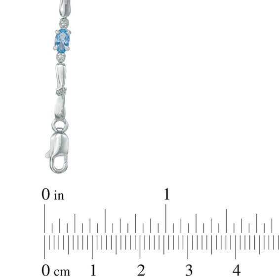 Oval Swiss Blue Topaz and Diamond Accent Bracelet in Sterling Silver