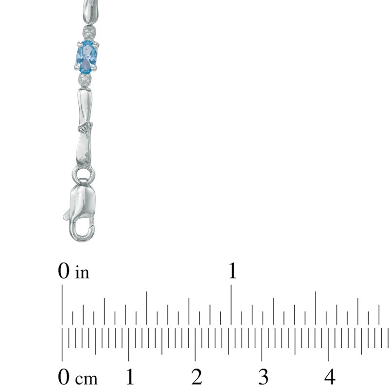 Main Image 2 of Oval Swiss Blue Topaz and Diamond Accent Bracelet in Sterling Silver