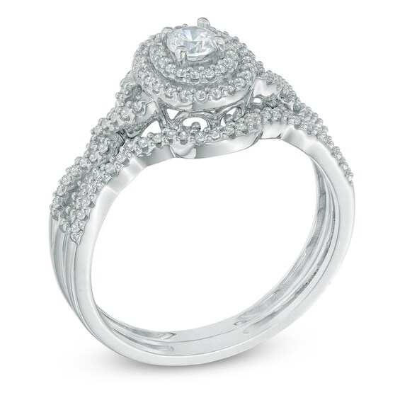 1/2 CT. T.w. Diamond Oval Frame Loose Braid Bridal Set In 10K White Gold