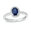 Thumbnail Image 1 of Oval Blue Sapphire and 1/7 CT. T.W. Diamond Frame Engagement Ring in 14K White Gold
