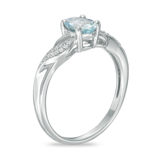 Oval Aquamarine and Diamond Accent Twist Ring in 10K White Gold