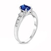Thumbnail Image 1 of Oval Blue Sapphire and 3/8 CT. T.W. Diamond Three Stone Ring in 14K White Gold