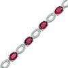 Thumbnail Image 0 of Oval Lab-Created Ruby and Diamond Accent Oval Outline Bracelet in Sterling Silver - 7.5"