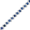 Thumbnail Image 0 of Oval Lab-Created Blue Sapphire and 1/10 CT. T.W. Diamond Cascading Bracelet in Sterling Silver - 7.25"