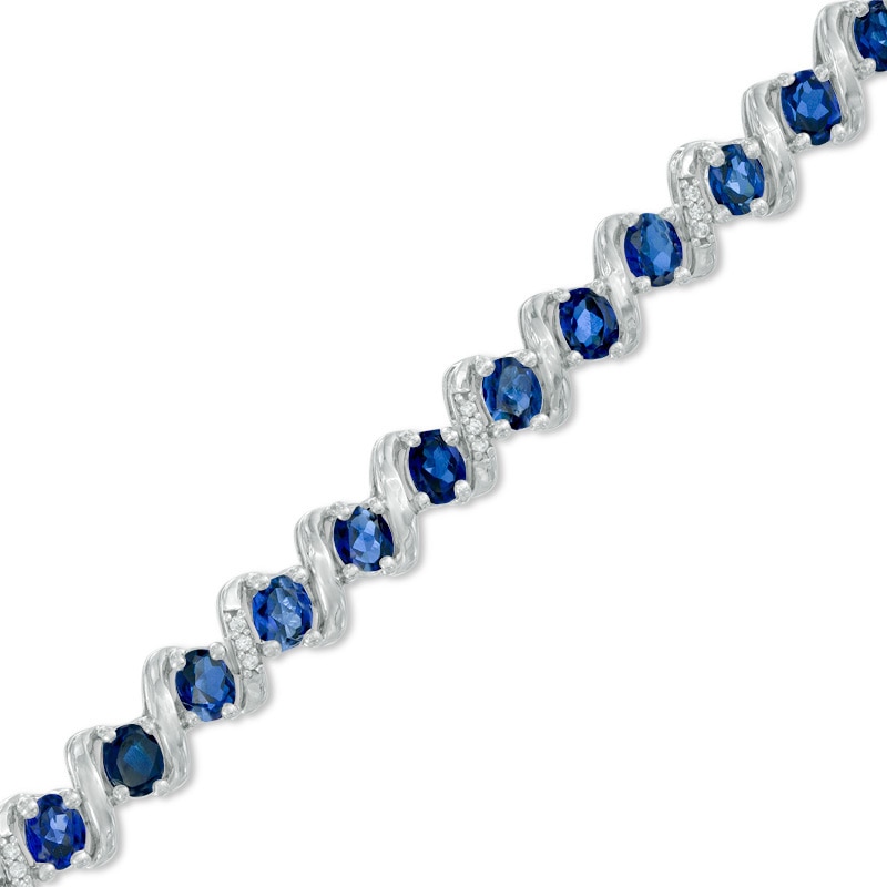 Oval Lab-Created Blue Sapphire and 1/10 CT. T.W. Diamond Cascading Bracelet in Sterling Silver - 7.25"