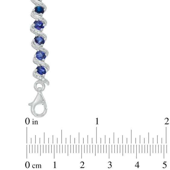 Oval Lab-Created Blue Sapphire and 1/10 CT. T.w. Diamond Cascading Bracelet in Sterling Silver - 7.25"