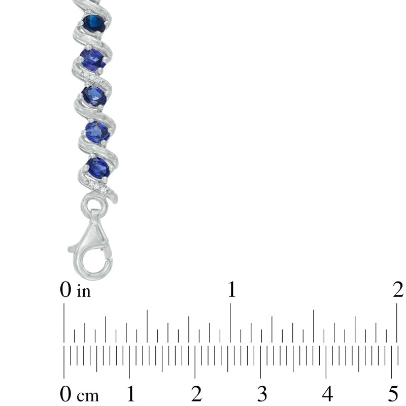 Oval Lab-Created Blue Sapphire and 1/10 CT. T.W. Diamond Cascading Bracelet in Sterling Silver - 7.25"