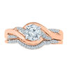 Thumbnail Image 1 of Lab-Created White Sapphire and 1/10 CT. T.W. Diamond Twist Bridal Set in 10K Rose Gold