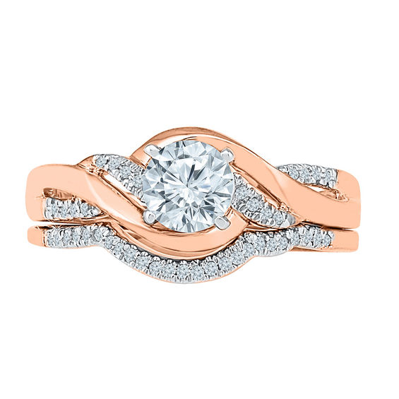 Lab-Created White Sapphire and 1/10 CT. T.w. Diamond Twist Bridal Set in 10K Rose Gold