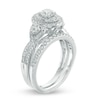 Thumbnail Image 1 of Celebration Ideal 1-1/5 CT. T.W. Diamond Layered Oval Frame Crossover Bridal Set in 14K White Gold (I/I1)