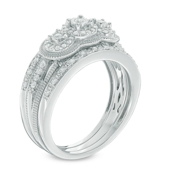1/4 CT. T.W. Diamond Frame Three Stone Vintage-Style Three-Piece Bridal Set in 10K White Gold 1/4 CT. T.W. Diamond Frame Three Stone Vintage-Style Three-Piece Bridal Set in 10K White Gold