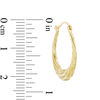 Thumbnail Image 1 of Textured Swirl Hoop Earrings in Hollow 14K Gold