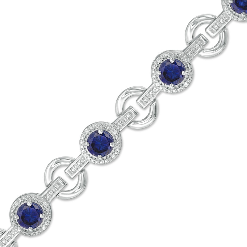 Main Image 1 of 5.0mm Lab-Created Blue Sapphire and 1/10 CT. T.W. Diamond Circle Link Bracelet in Sterling Silver - 7.25&quot;