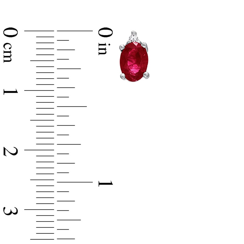 Oval Ruby and Diamond Accent Stud Earrings in 14K White Gold