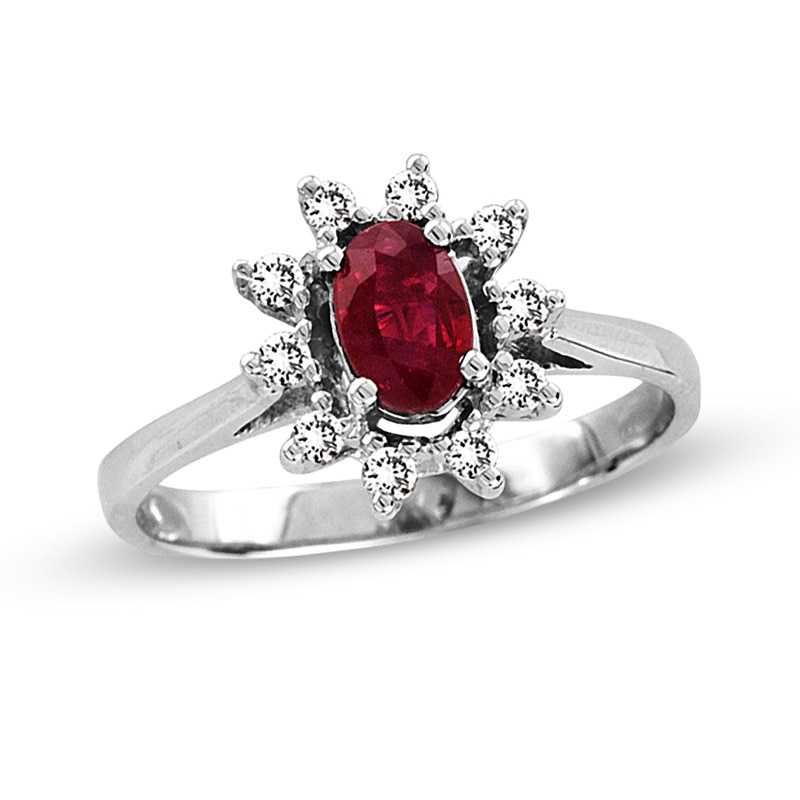 Oval Ruby and 1/6 CT. T.W. Diamond Sunburst Frame Ring in 14K White Gold