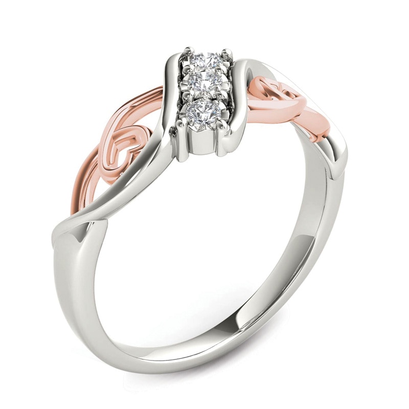 1/10 CT. T.W. Diamond Three Stone Bypass with Hearts Ring in 14K White Gold and Rose Rhodium