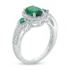 Thumbnail Image 1 of Oval Lab-Created Emerald and White Sapphire Frame Three Stone Ring in Sterling Silver