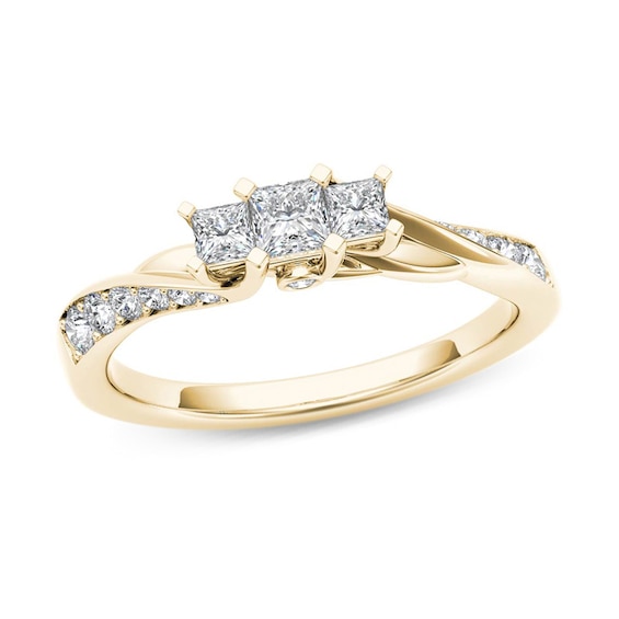 1/2 CT. T.w. Princess-Cut Diamond Three Stone Twist Shank Ring in 14K Gold