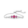 Thumbnail Image 0 of Oval Lab-Created Ruby and 1/5 CT. T.W. Diamond Three Stone Bolo Bracelet in Sterling Silver - 9.5"