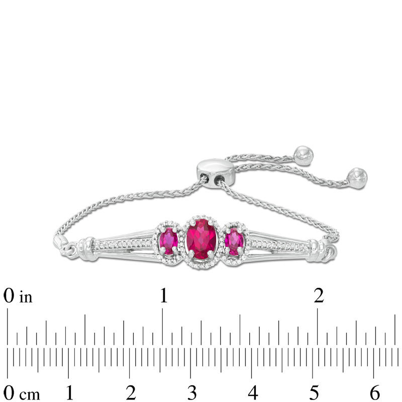 Oval Lab-Created Ruby and 1/5 CT. T.W. Diamond Three Stone Bolo Bracelet in Sterling Silver - 9.5"