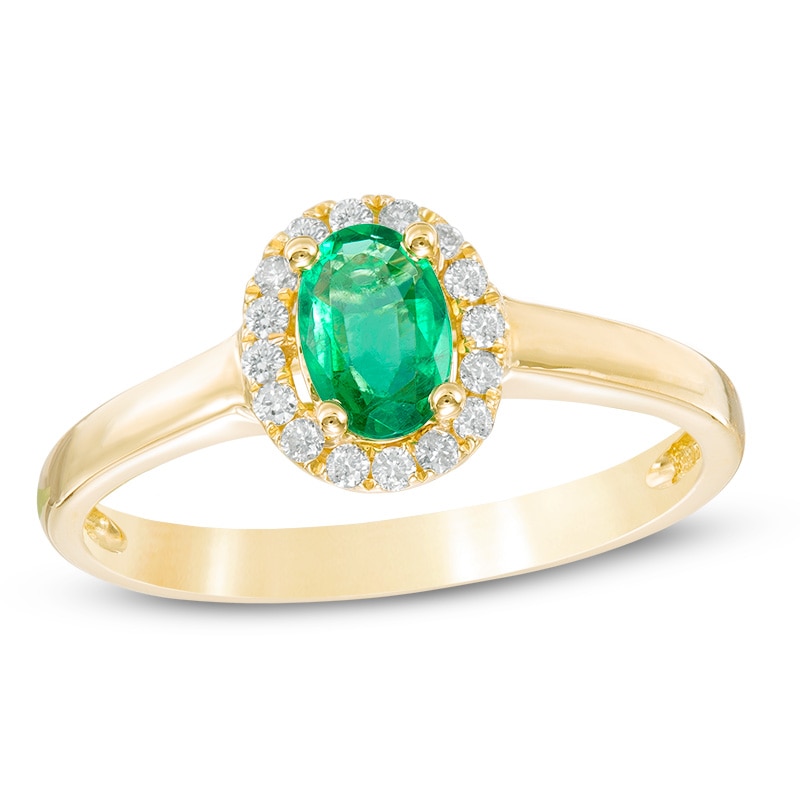 Oval Emerald and 1/10 CT. T.W. Diamond Frame Ring in 10K Gold