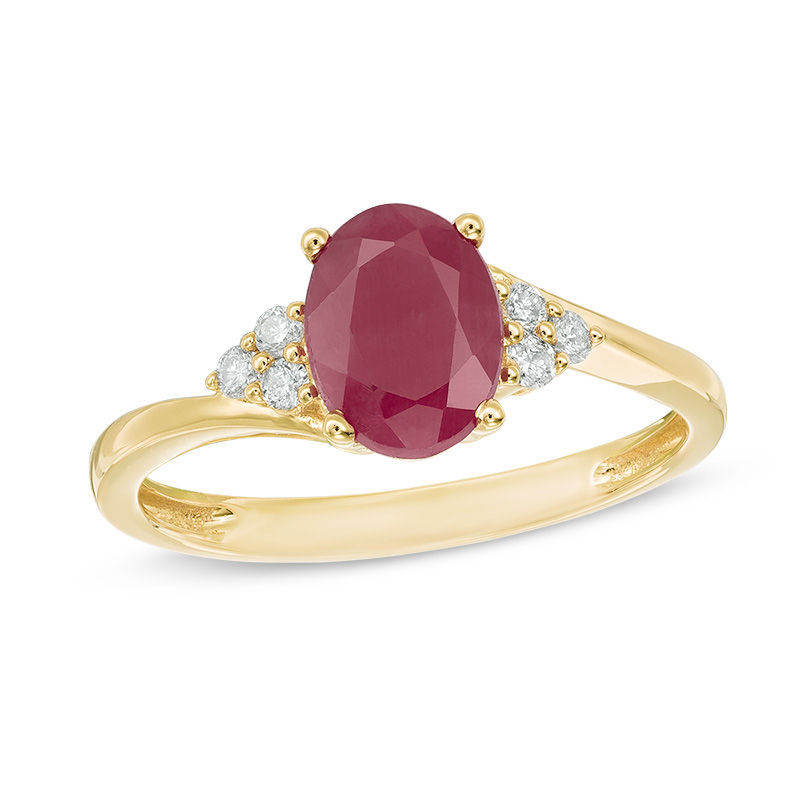 Oval Ruby and 1/10 CT. T.W. Diamond Tri-Sides Ring in 10K Gold