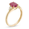 Thumbnail Image 1 of Oval Ruby and 1/10 CT. T.W. Diamond Tri-Sides Ring in 10K Gold