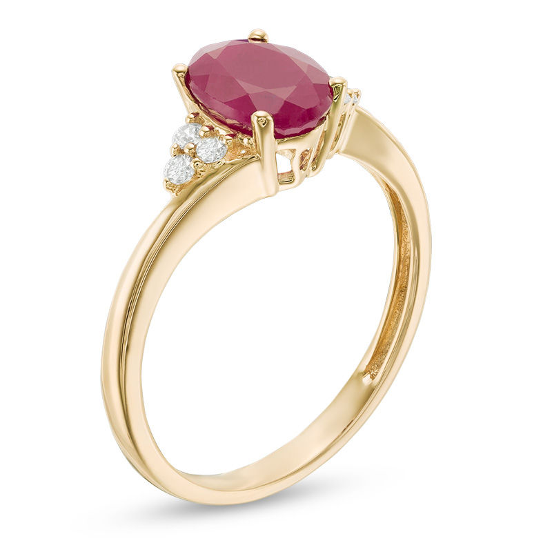 Oval Ruby and 1/10 CT. T.W. Diamond Tri-Sides Ring in 10K Gold