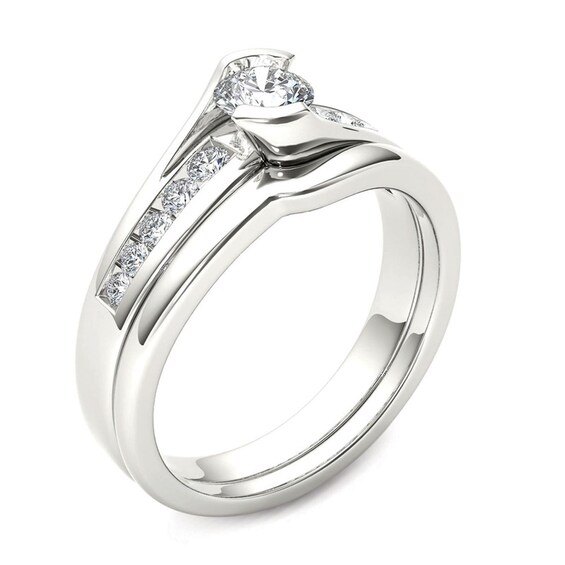 1/2 CT. T.w. Diamond Bypass Bridal Set in 14K White Gold