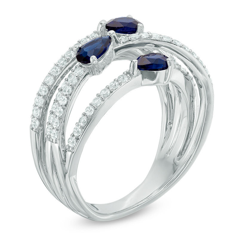 Lab-Created Blue and White Sapphire Three Stone Orbit Ring in Sterling Silver