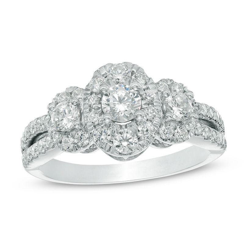 11/4 CT. T.W. Diamond Oval Frame Three Stone Engagement Ring in 10K