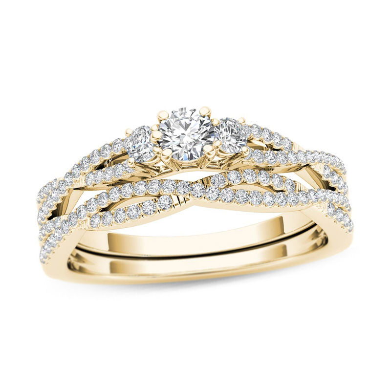 Main Image 1 of 1/2 CT. T.W. Diamond Three Stone Twist Bridal Set in 14K Gold