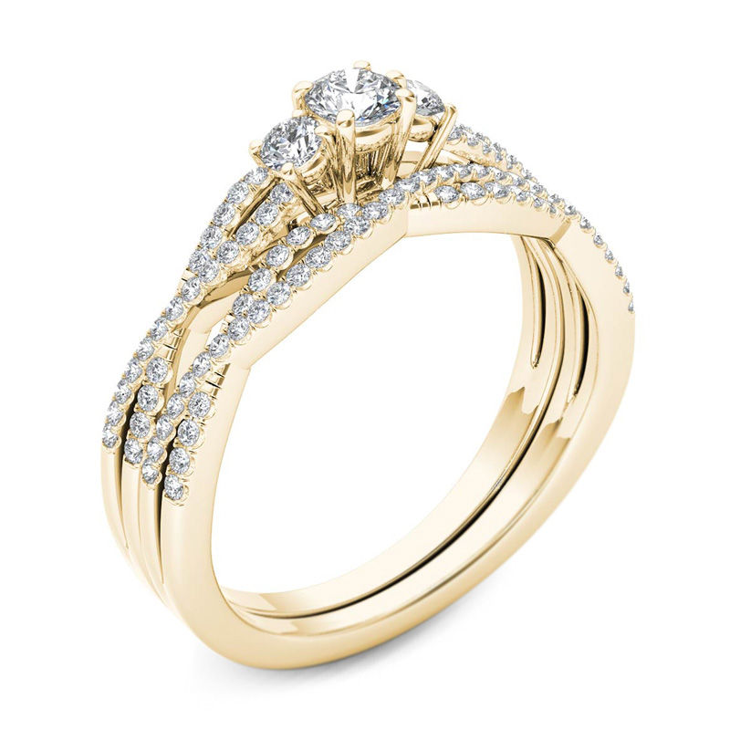 Main Image 2 of 1/2 CT. T.W. Diamond Three Stone Twist Bridal Set in 14K Gold