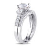Thumbnail Image 1 of 6.0mm Lab-Created White Sapphire and 1/8 CT. T.W. Diamond Three Stone Bridal Set in 10K White Gold