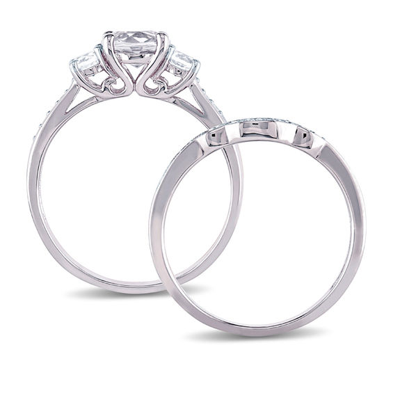 6.0mm Lab-Created White Sapphire and 1/8 CT. T.w. Diamond Three Stone Bridal Set in 10K White Gold