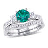 Thumbnail Image 0 of 6.0mm Lab-Created Emerald and White Sapphire with 1/8 CT. T.W. Diamond Three Stone Bridal Set in 10K White Gold