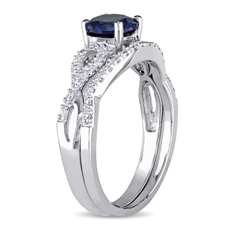 6.0mm Lab-Created Blue Sapphire and 1/8 CT. T.W. Diamond Twist Shank Bridal Set in 10K White Gold