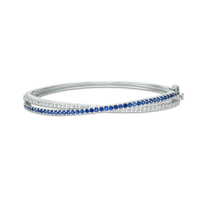 Lab-Created Blue and White Sapphire Crossover Ribbon Bangle in Sterling Silver