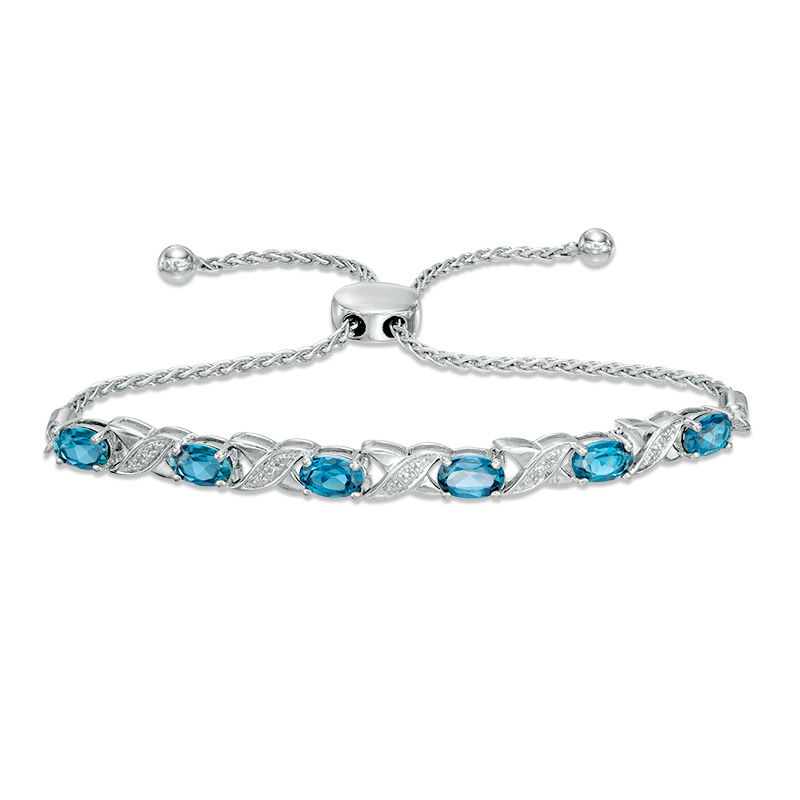 Main Image 1 of Oval Swiss Blue Topaz and Diamond Accent "XO" Bolo Bracelet in Sterling Silver - 9.5"