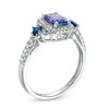 Thumbnail Image 1 of Tanzanite, Blue Sapphire and 1/6 CT. T.W. Diamond Three Stone Ring in 14K White Gold