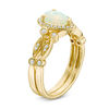 Thumbnail Image 1 of Pear-Shaped Opal and 1/8 CT. T.W. Diamond Frame Vintage-Style Bridal Set in 14K Gold