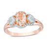 Thumbnail Image 0 of Oval Morganite, Aquamarine and 1/8 CT. T.W. Diamond Frame Three Stone Ring in 10K Rose Gold