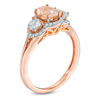 Thumbnail Image 1 of Oval Morganite, Aquamarine and 1/8 CT. T.W. Diamond Frame Three Stone Ring in 10K Rose Gold