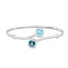 Thumbnail Image 1 of 7.0mm London and Swiss Blue Topaz with Lab-Created White Sapphire Frame Bypass Bangle in Sterling Silver - 7.5"